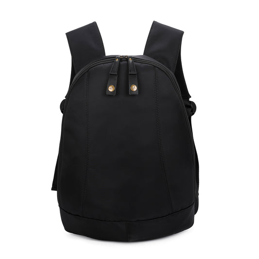 A black arsayo backpack with dual top zipper pulls featuring gold-tone circular hardware, shown against a plain white background.